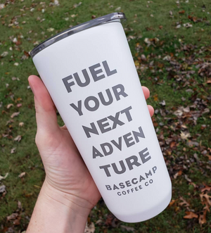 White Metal Travel cup saying "Fuel Your Next Adventure - Basecamp Coffee Co"